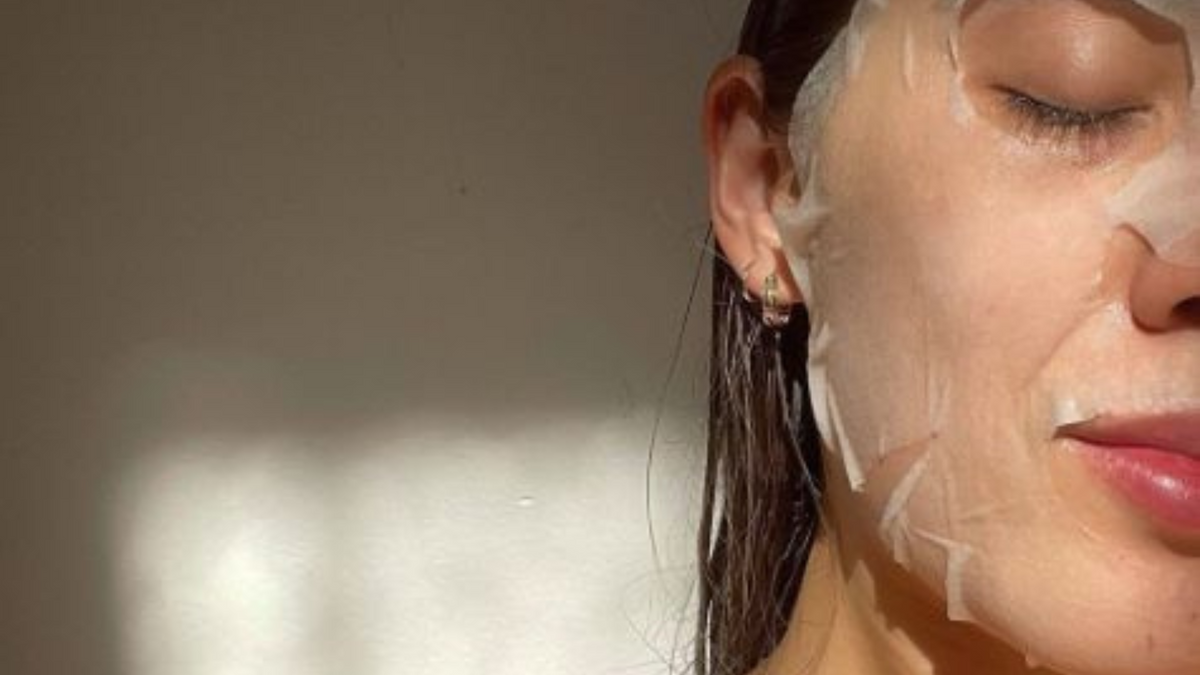 Biocellulose sheet mask laid flat, showing its thin translucent second-skin texture