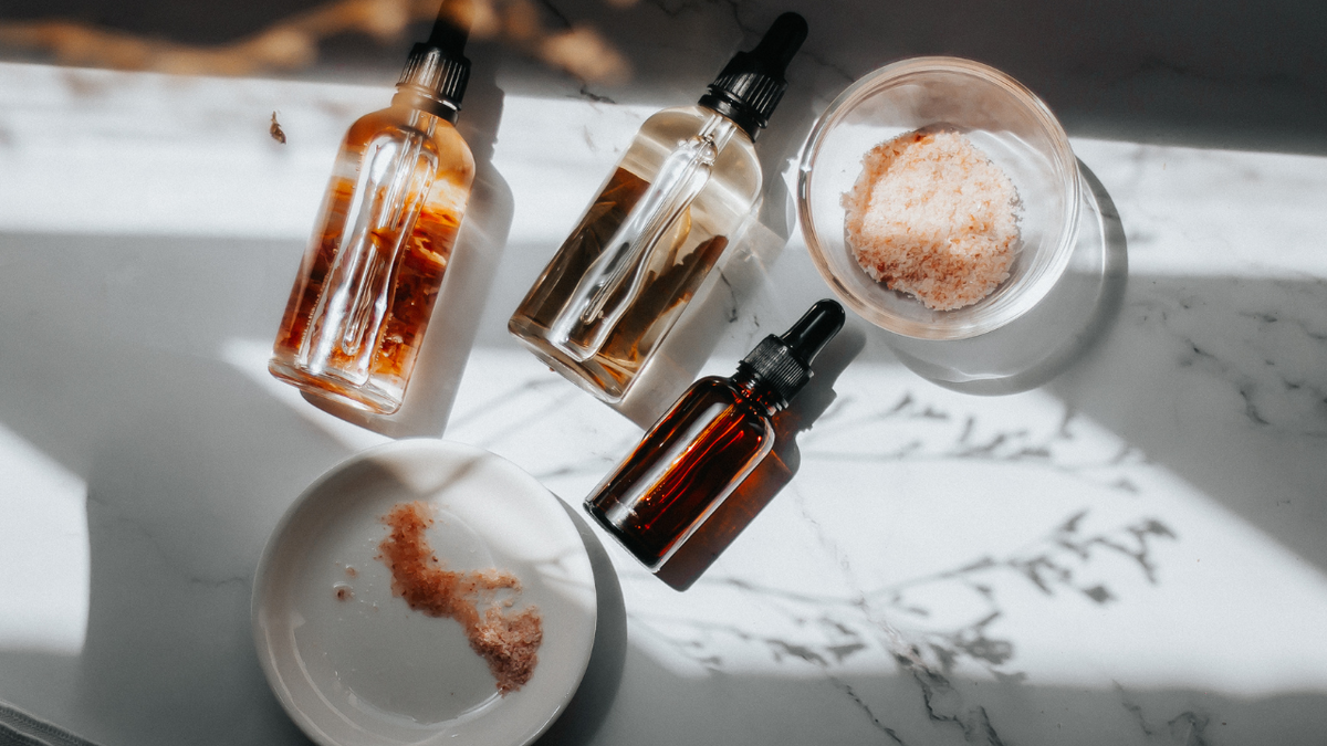 Botanical skincare ingredients laid out on a natural surface